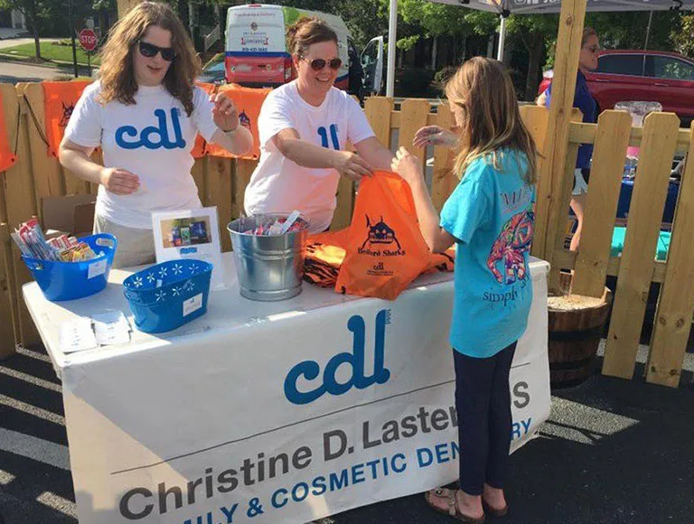 Two team members at community event