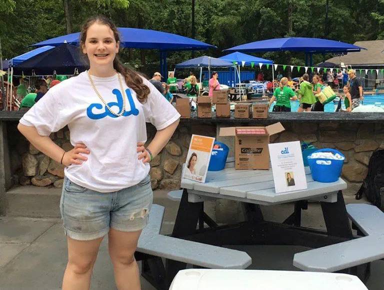 Smiling team member at community event