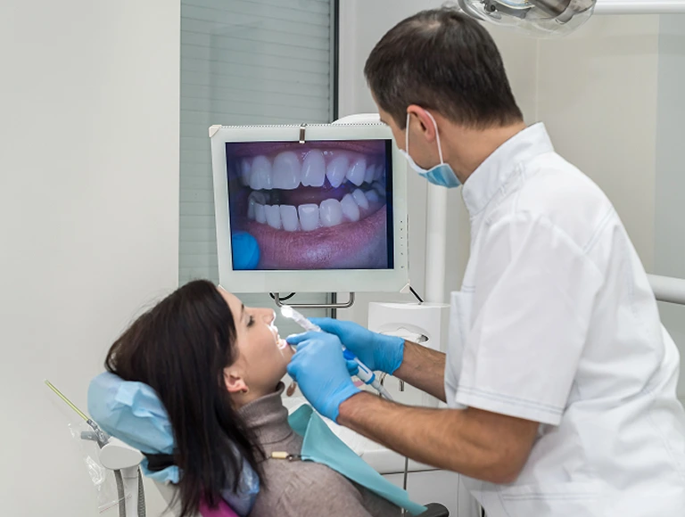 Dentist capturing intraoral images